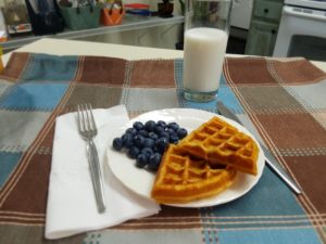 Waffles and fresh blueberries on a plate