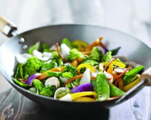 Fresh stir-fry vegetables in a wok